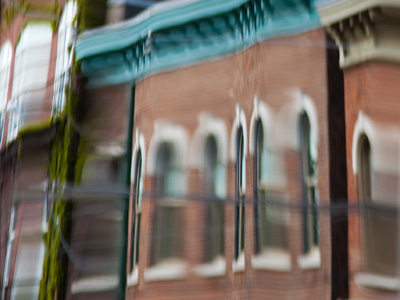 Wayne Avenue warped in a wavy window.