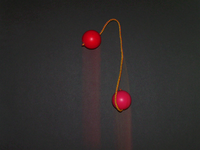 Using first curtain flash, these rubber balls seem to be falling up.