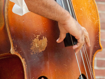 The worn spot is where he slaps that bass.