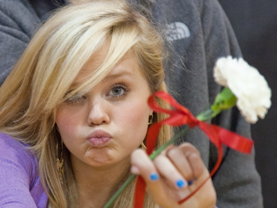 Proud of her flower.