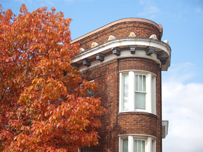 A really skinny guy lives in that little corner apartment.