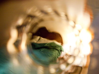 Bedroom, with semi-made bed.