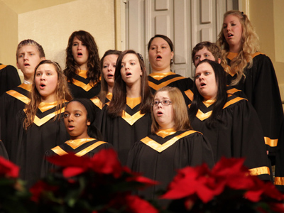 Suddenly, a choir sprouted from the poinsettias.