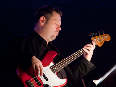 Vinnie Marshall plays bass and provides witty comments.