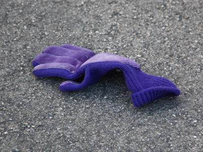 An hour later, miles away, another purple glove.