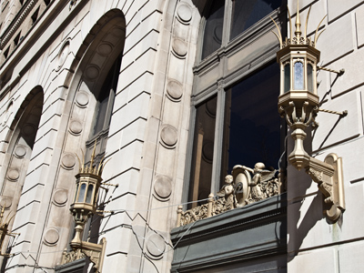 Lacking any sense of style, the building`s present owners have hung a string of cheap plastic lights over the door.