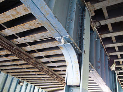 It`s unlikely that the train overhead will come crashing down as I pass under the bridge -- but I walk fast anyway.