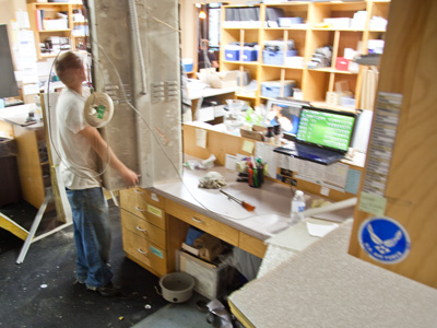 My coworker was on the phone when the ceiling, and that large lamp, came crashing down on her head.  She politely ended the conversation and then went to find a first aid kit.