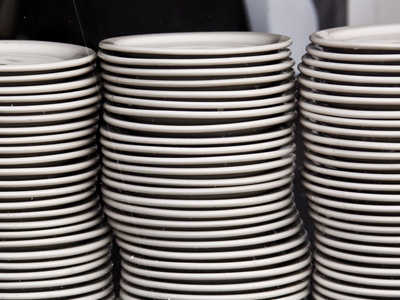 A restaurant by the river keeps their plates in a windowsill.