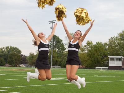 For a photographer, it`s a really good day when a couple of girls in white boots approach and say, `Do you want to take our picture, jumping and throwing our pom-poms?`