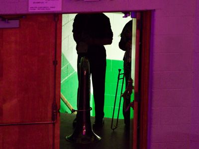 The brass ensemble waits in the wings for their turn.