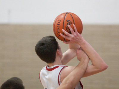 Why there are three referees.  A coach, standing far away, disputed the foul call made by the ref standing nearby.