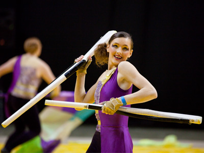 This performer happened to sit by me early in the morning.  Later she proved that spinning just one rifle is for sissies.