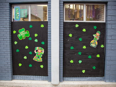 Text:  Welcome to the Oregon District, St. Patrick`s Day partiers.  Subtext:  Don`t break our windows.