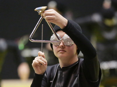 Color guard teams perform to recorded music, while these teams create their own with percussion instruments.