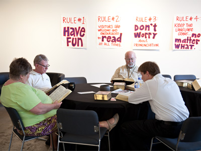 The complete works of William Shakespeare are being read aloud at this table.