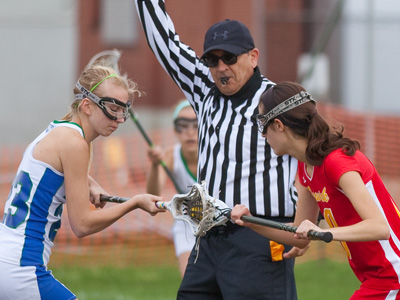 Boys play this game with helmets and padding, but girls go at it with just a small mask and maybe a little lip gloss.