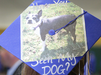The class president just wants to find her missing dog, but she wasn`t allowed to wear this cap during the ceremony.