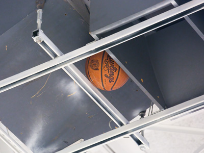 High above -- very high above -- the gym floor.