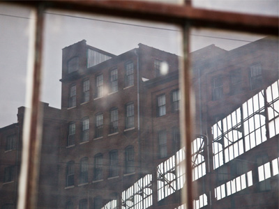 Through a glass grimy.