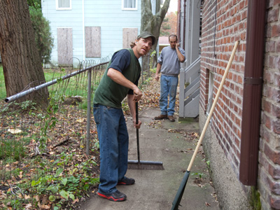 Would YOU ask a total stranger carrying a camera to take your picture?  Me neither.  Oh well, these guys did a heroic job of removing leaves around this building.  Say cheese!