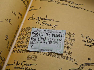 J. R. R. Tolkien didn`t write this line:  `Dad, why are there dwarves coming out of our toilet?  Will they bring us luck?`  Tolkien is responsible for only about 25% of the movie.