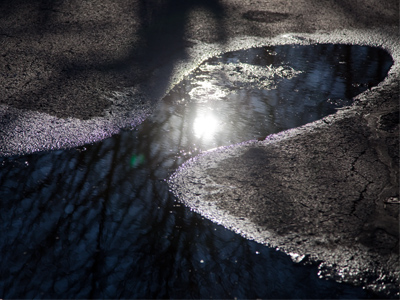Puddle in the parking lot at 4:06pm.