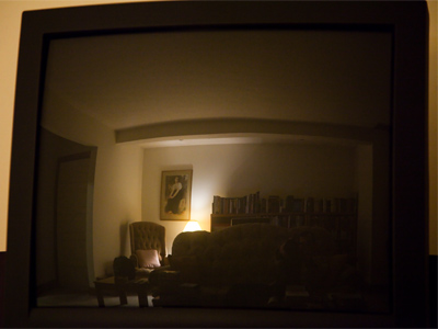My living room reflected in the unused television.