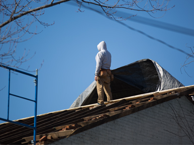 Putting the roof back together after Thursday`s storm.
