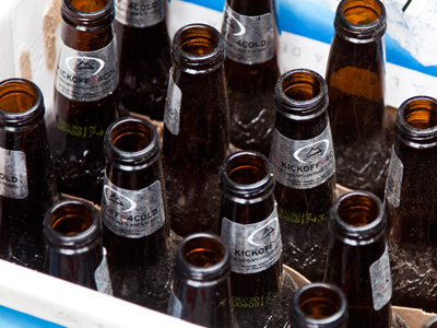 In the alley outside an apartment, not a bar.