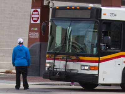 Stalemate:  bus driver blows horn, man refuses to move.