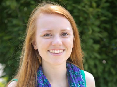 I asked her to stand out of the sun while I took her picture.  She said, `Out of the sun.  I like that.`