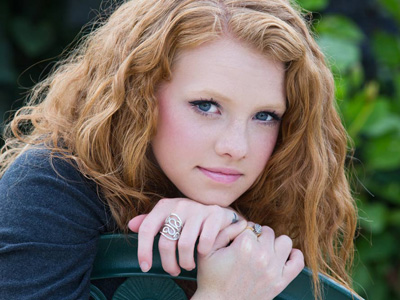 The younger sister is a high school cheerleader.