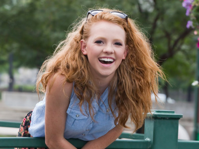 She`s laughing at some dumb guys hooting at her.