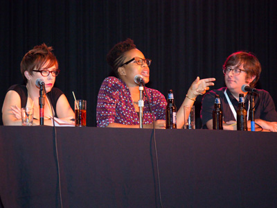 A panel of experts listens to movie ideas from the crowd.