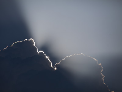 This photo is completely unedited.  This is just what I saw.  The sun came out from behind the cloud a moment later.