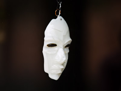 We wear the mask that grins and lies, It hides our cheeks and shades our eyes. PAUL LAURENCE DUNBAR