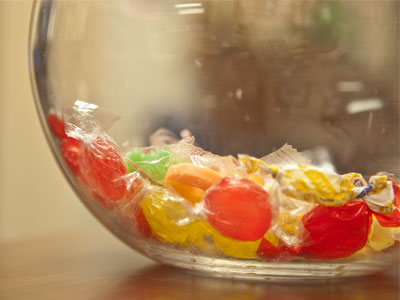 The bowl has candy AND cough medicine.  Trick or treat!