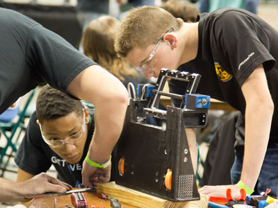 They work hard to construct a robot . . . 