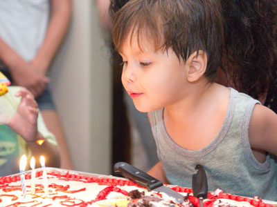 The three-year-old got to blow out the candles.
