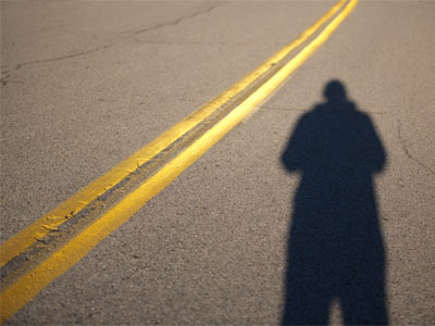 Follow the yellow-striped road.