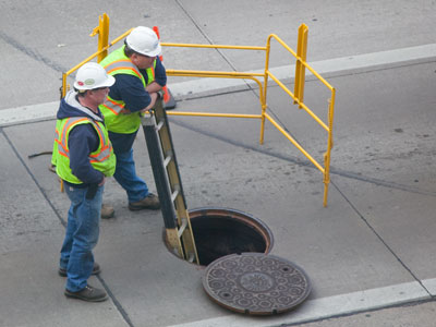 Someone`s got to stand there and hold the ladder.  And someone else has to stand there and watch him hold it.