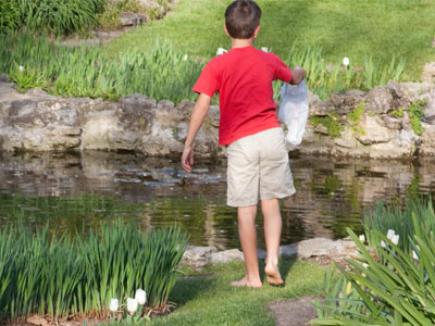 Junior poacher, collecting bag in hand.