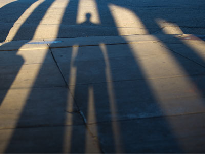 I emerge from the shadows for another morning walk.