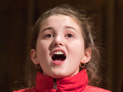 Tiny altos with their eyes all aglow.