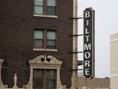 See the wires helping to hold this sign on the building?