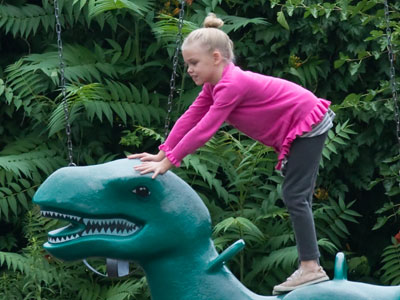 Dinosaur surfing.