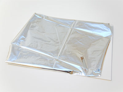 Tape the mylar to a piece of paper.