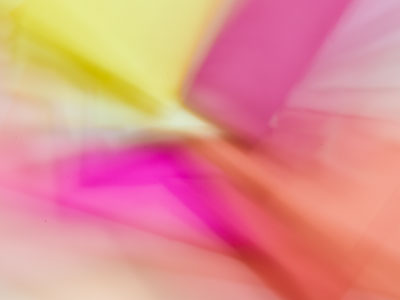 With the crepe paper out of focus, spin the camera and zoom in and out while taking a picture.