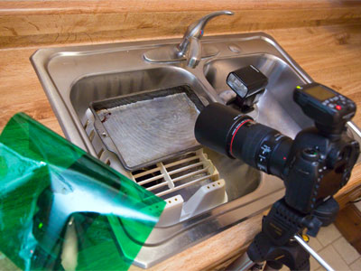 Fill the baking pan with water and let the faucet drip.